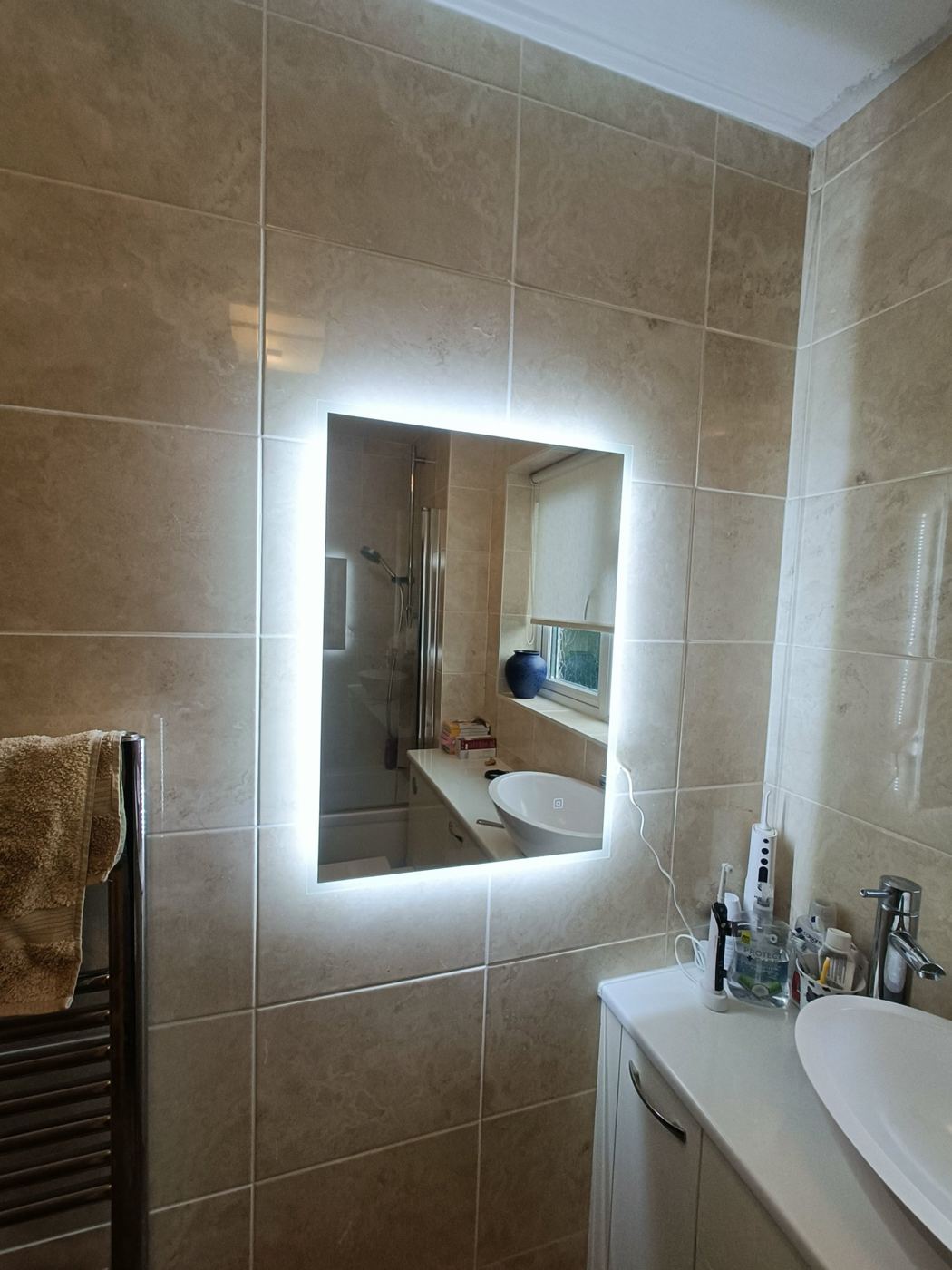 Illuminated bathroom mirror installation